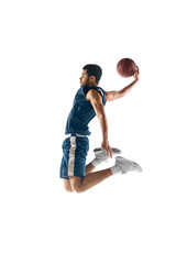 Up to win. Young arabian muscular basketball player in action, motion isolated on white background....