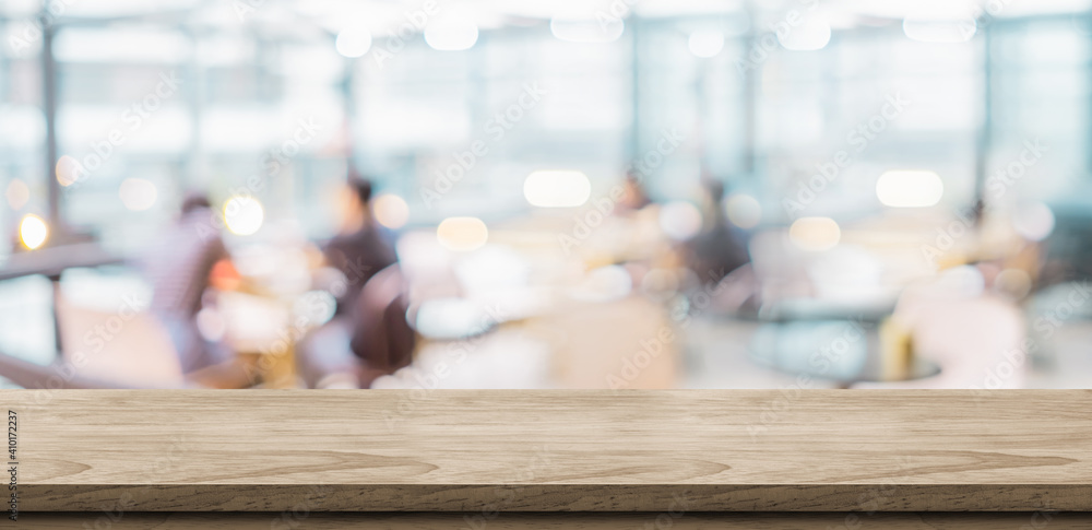 Aufkleber Empty rustic wood table and blurred soft light in restaurant with bokeh background. product display template.Business presentation