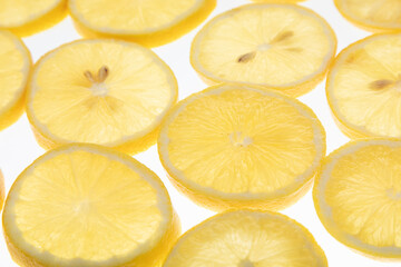 lemon slices with seeds on white background  