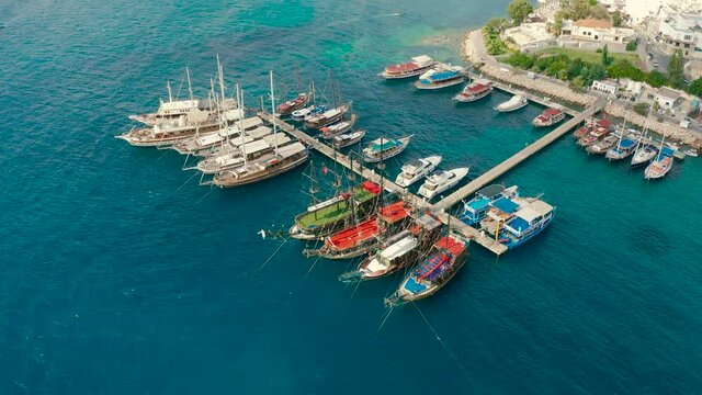 Old Gulet Wooden Sailboats at harbor in Bodrum Marina, Turkey. Amazing Bodrum aerial view from the sky.
