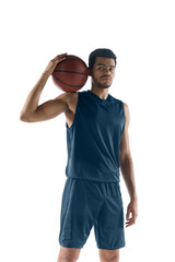 Unstoppable. Young arabian muscular basketball player posing confident isolated on white...