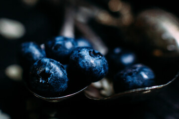 Blueberry berries close-up on a dark background