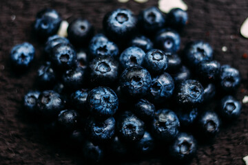 Blueberry berries close-up on a dark background