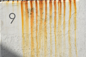 Grunge white wall with rust streaks