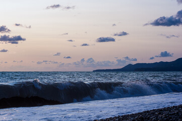 Fototapeta premium Amazing sea sunset, the sun, waves, clouds