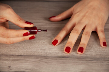 woman hand nail varnish