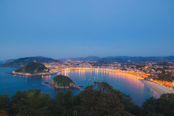 Classic evening cityscape view of Ondaretta and La Concha beaches of San Sebastian, Basque country...