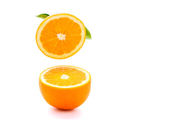 Fresh orange cut in half on white background