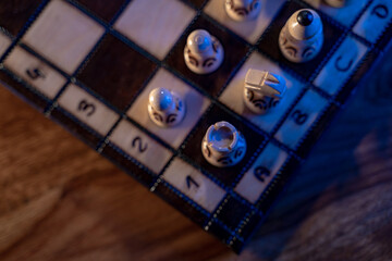 Chess board with chess pieces on blue background. Concept of business ideas and competition and strategy ideas. White rook close up.