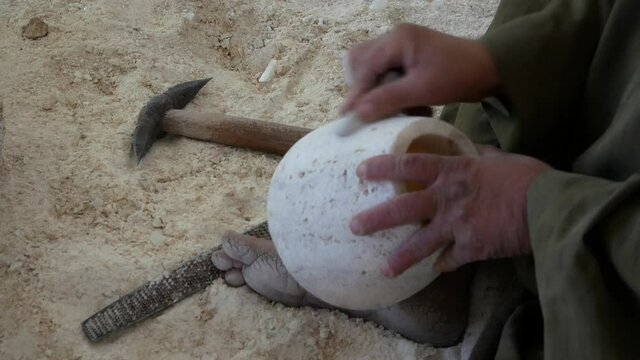 Craftsmen make a vase from stone using ancient Egyptian technology
