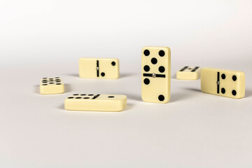 A game of dominoes on a light background. Close-up. Selective focus.