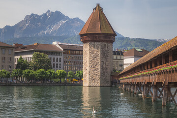 The famous pedestrian Chapel Bridge (Kapellbrcke) over the Reuss River in Lucerne, Switzerland on a...