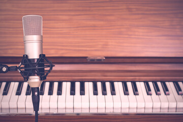 condenser microphone on piano background
