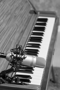 condenser microphone on piano background