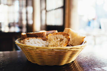 bread in basket on wooden table