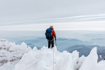 person looking over a landscape while Climbing Mt rainier in united states washington for corporate...