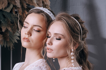 young girls in bridal jewelry and boudoir robes