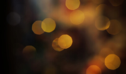 A bokeh shot of dust particles: big, huge round spots, vintage color tones.
