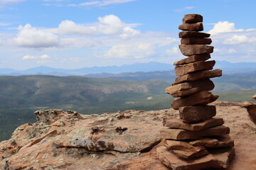 Fototapeta na wymiar Cairns or towers of balanced rocks standing perfectly along the Mogollon Rim in Northern Arizona.