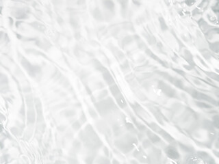 Fototapeta na wymiar Ripple water texture on white background. Shadow of water on sunlight. Mockup for product, spa or travel background. Marble blue water surface as wallpaper background