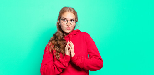 blonde pretty woman scheming and conspiring, thinking devious tricks and cheats, cunning and...