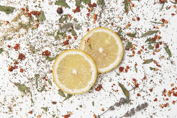  Dry herbs and lemon slices on white. Herbs in bulk, zero waste and eco-friendly lifestyle, herbal...