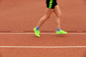 Long distance runners are running on the track