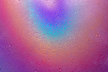 Fototapeta premium Background of drops of water on multicolor surface .