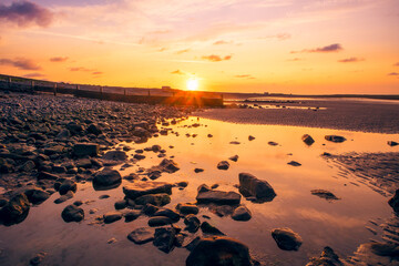 Obraz premium Stone beach at sunrise