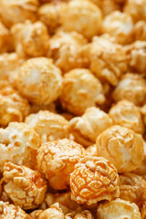 Popcorn in caramel glaze close-up as a background.