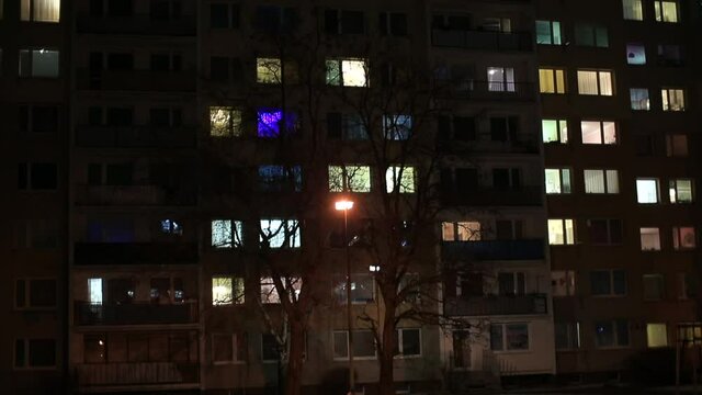 The windows of an apartment building in the evening in the city. Place of residence of people in the megalopolis. Self-isolation during lockdown. A place to rest and sleep.
