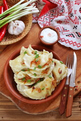 Dumplings with potatoes, green onions and sour cream