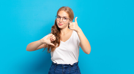 blonde pretty woman feeling confused, clueless and unsure, weighting the good and bad in different...