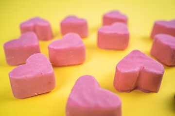 Valentines day pink hearts on yellow background
