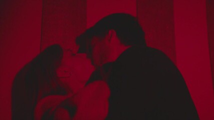 passionate kisses in a nightclub