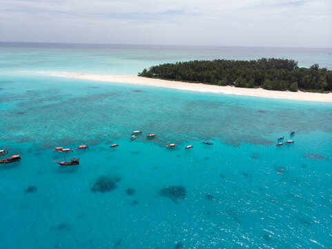Aerial view of Boats Staying near Mnemba Atoll in Zanzibar - The Famous Spot for Snorkeling and Boat Tour