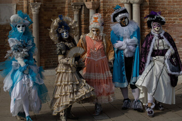 Fototapeta na wymiar city carnival masked family