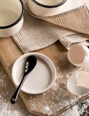 eggshell and plate on table. Flat lay top-down