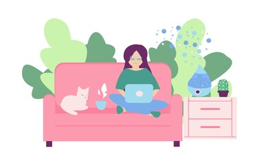 Freelancer working at home Young women seat on sofa with note book and humidifier on nightstand The cat lies next to the girl