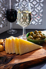 Tasting of fortified Andalusian dry and sweet sherry wine with traditional Spanisch tapas, green olives, goat and sheep manchego cheese