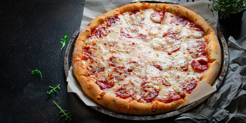 pizza pepperoni with meat sausage and double cheese fast food Takeaway ready to eat portion on the...