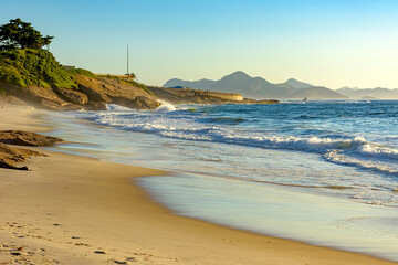 Devil's Beach in Ipanema Rio de Janeiro deserted at dawn with mountains in the background