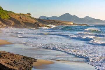 Devil's Beach in Ipanema Rio de Janeiro deserted at dawn with mountains in the background