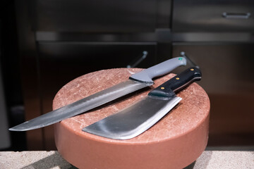 Butcher knives on the cutting board.