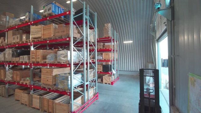 Warehouse or stock of materials, racks, boxes, containers. Shelves with goods or commodity