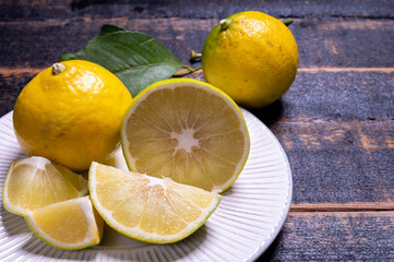 Obraz na płótnie Canvas Fresh ripe bergamot orange fruits, fragrant citrus used in earl grey tea, medicine and spa treatments