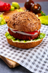 Tasty hamburger made with vegetarian plant based imitation minced meat burger and fresh vegetables