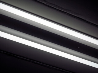 Fototapeta premium parallel of fluorescent lights on cieling background