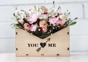 Flower tender composition in a wooden box. Mother Day, Valentine, love concept