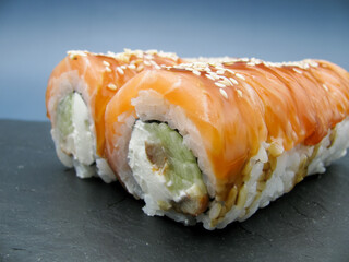 Sushi Philadelphia. Sushi with cream cheese, cucumber, eel fish, rice, salmon and sesame seeds.